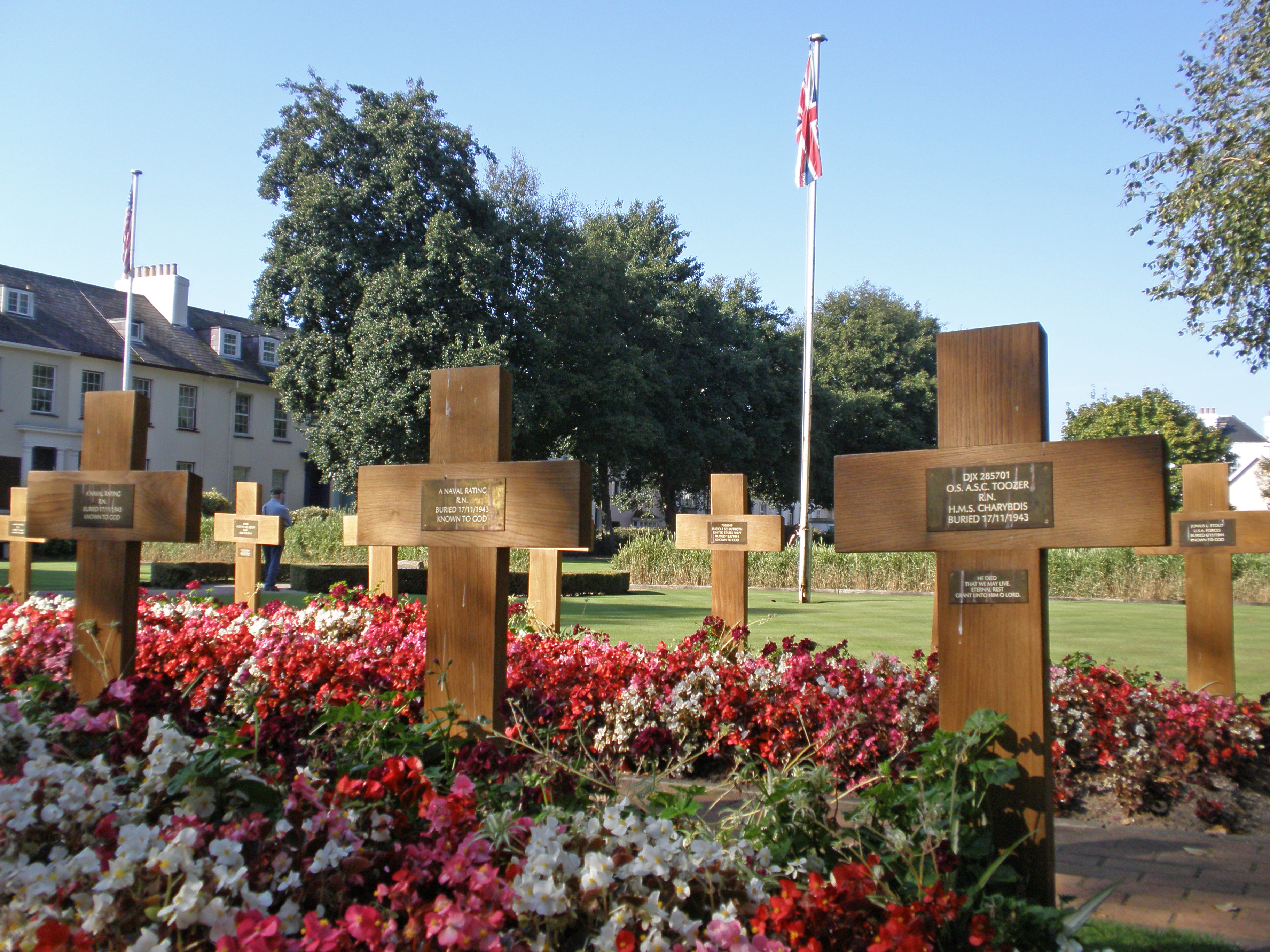 Rows of white naval headstones in the war cemetery at Howard Davis Park, Jersey.